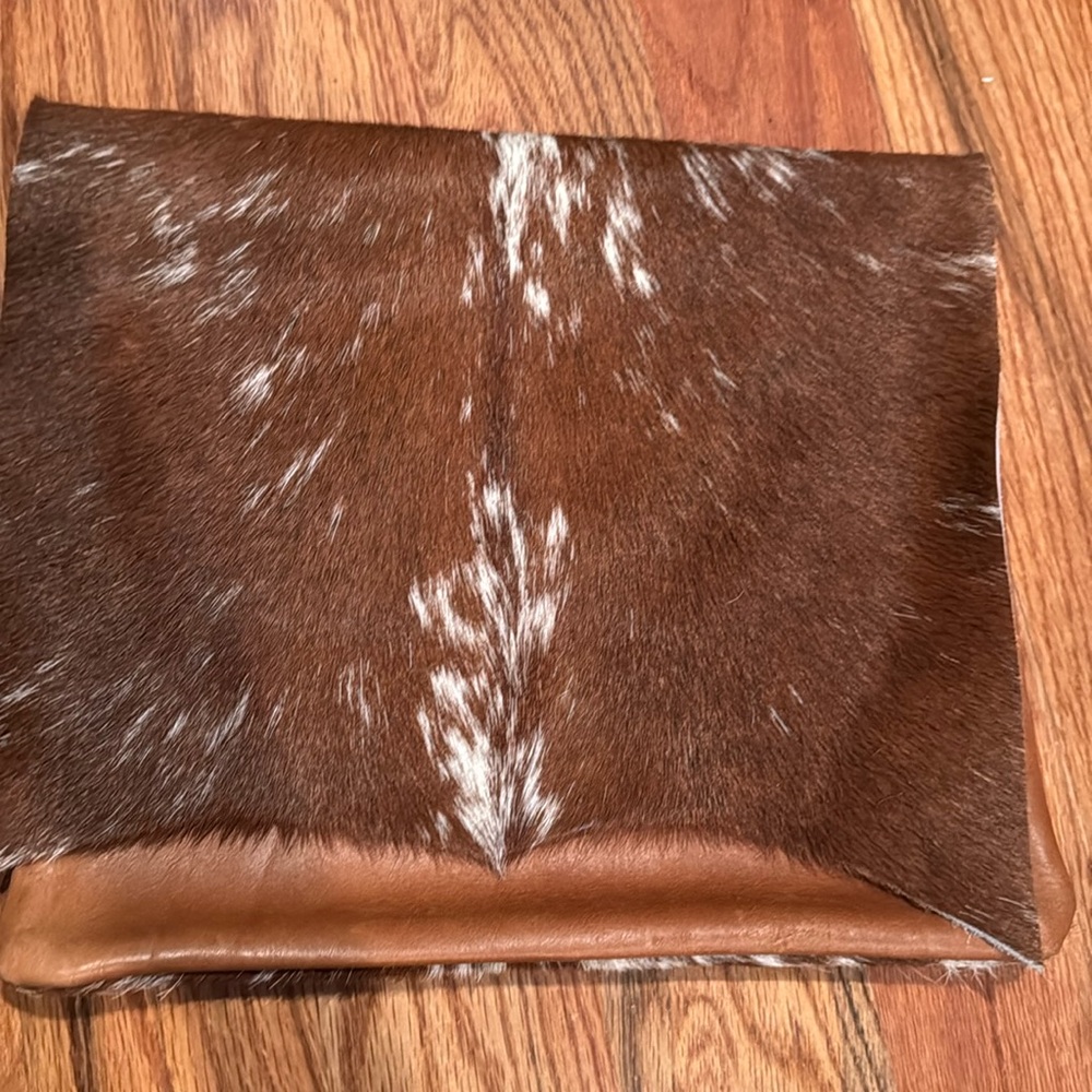 Brown and White Cowhide Clutch
